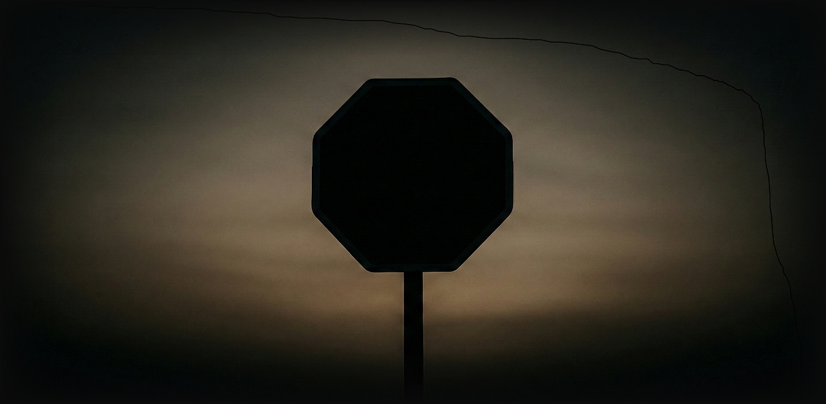A stop sign at dusk, symbolizing shared expectations in broad economies